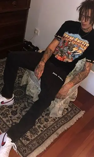 Kizaru wearing Palm Angels pants