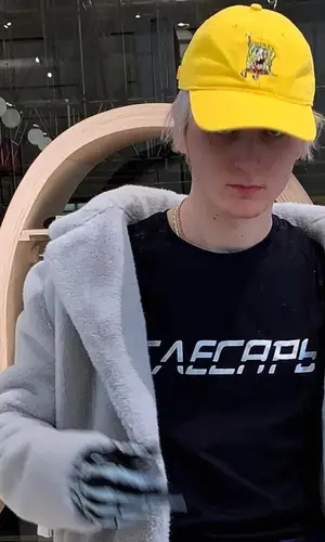 Платина wearing J Balvin Merch cap