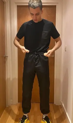LIL KRYSTALLL wearing Prada sneakers