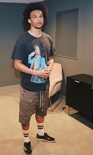Leroy Sane wearing Beautiful Struggles t-shirt