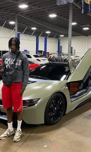 Polo G wearing Louis Vuitton bag