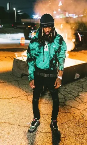 King Von wearing Amiri jeans