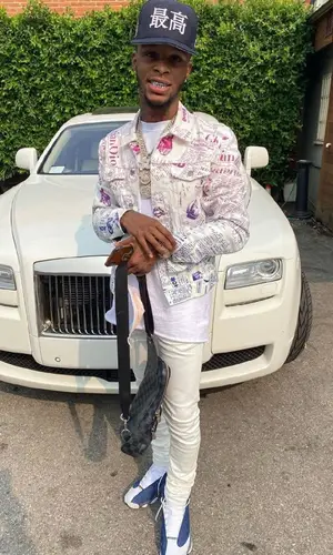 Toosii wearing Louis Vuitton bag