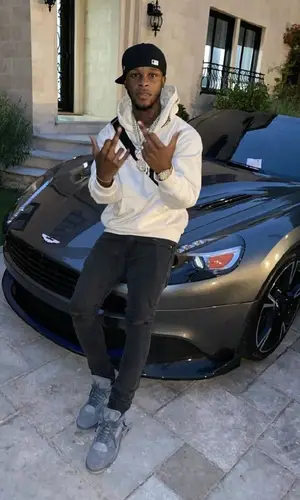 Toosii wearing Louis Vuitton bag