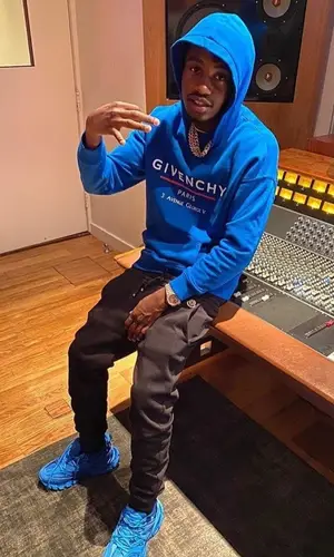Lil Tjay wearing Givenchy sweatshirt