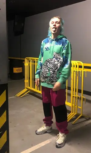 13Kai wearing Nike pants