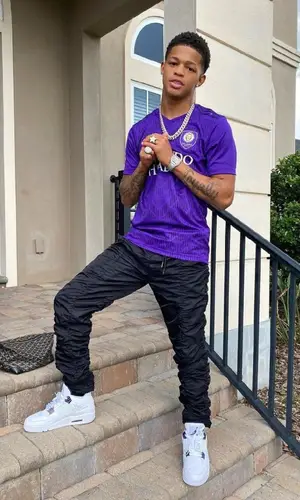 YK Osiris wearing Goyard bag