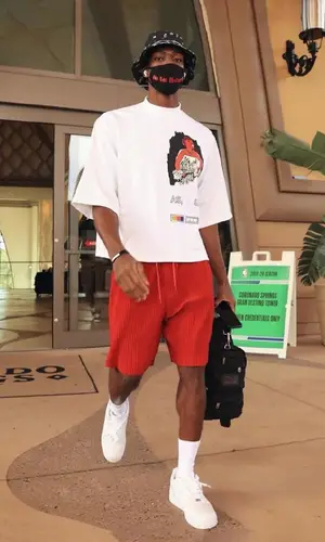 Rajon Rondo wearing Pyer Moss t-shirt