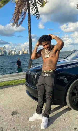 YFN Lucci wearing Valentino belt
