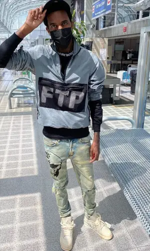 Lil Reese wearing N9nety-9ne jeans