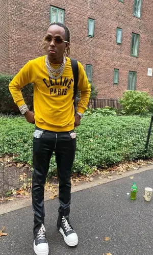 Rich The Kid wearing Celine sweater