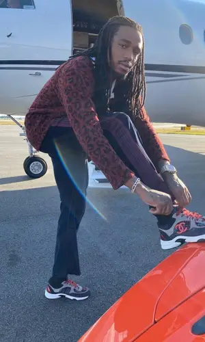 Quavo wearing Saint Laurent top
