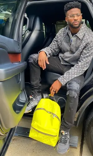 Emmanuel Sanders wearing Louis Vuitton backpack