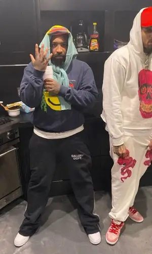 Chris Brown wearing Cosey X Cosey hoody