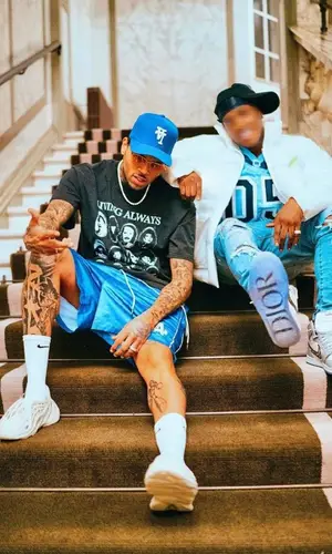 Chris Brown wearing Kill the Hype cap