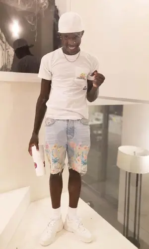 Quando Rondo wearing Amiri shorts