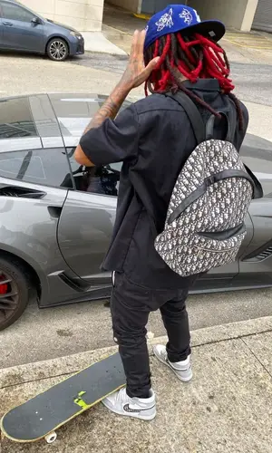 Lil Gnar wearing Demoworld cap