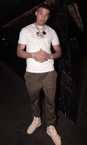 Fredo wearing Louis Vuitton t-shirt