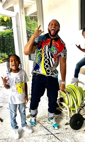 El Alfa El Jefe wearing Versace shirt