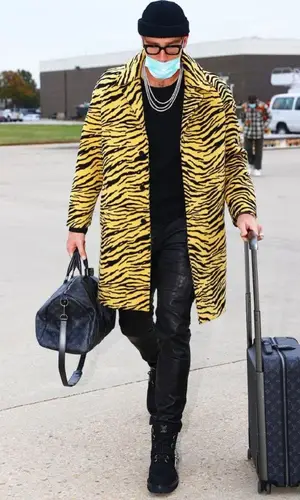 Travis Kelce wearing Amiri pants
