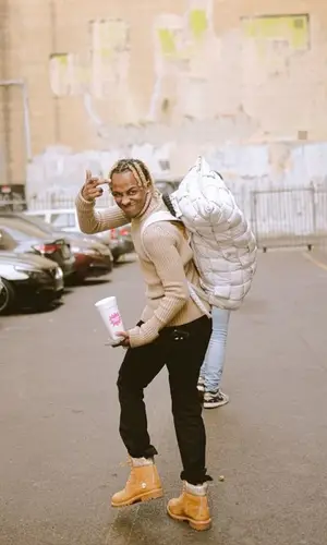 Rich The Kid wearing Bottega Veneta sweater