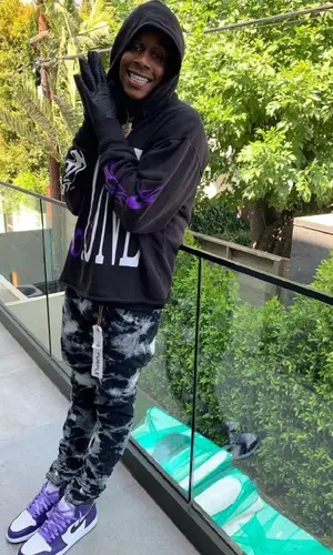 DJ Kid wearing Purple Brand jeans