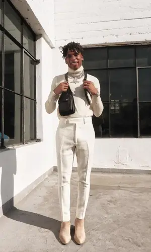 NLE Choppa wearing Amiri bag
