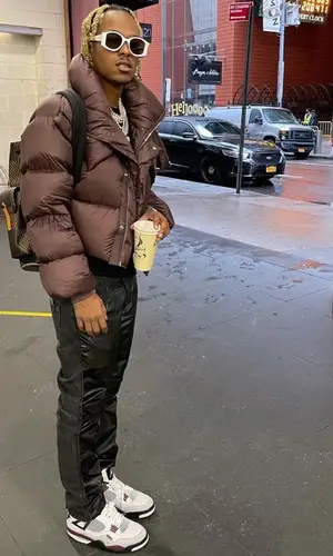 Rich The Kid wearing Louis Vuitton backpack