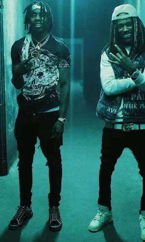 King Von wearing Amiri jeans