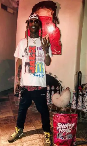 Chris King wearing Supreme cap