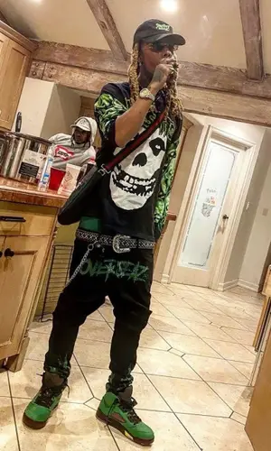 Chris King wearing Out The Grave top