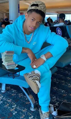 YK Osiris wearing Nike hoody