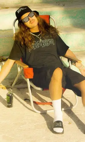 Yung Pinch wearing Yung Pinch Merch t-shirt