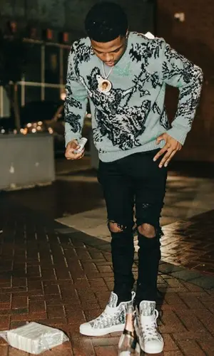 TJ Porter wearing Amiri jeans