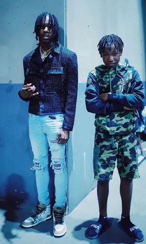 YNW BSlime wearing Nike sock