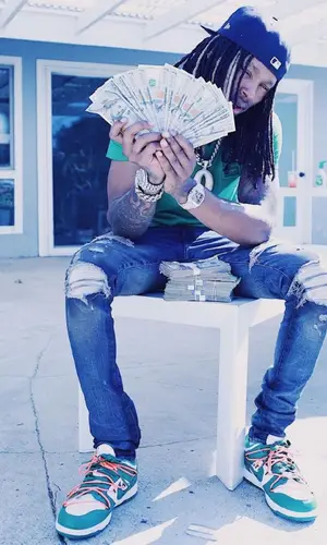 King Von wearing Amiri jeans
