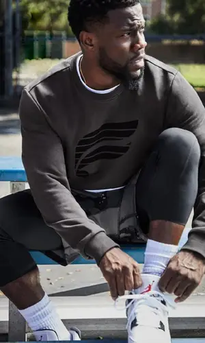 Kevin Hart wearing Fabletics sweatshirt