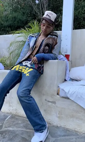 24kGoldn wearing Guitar Boys jeans