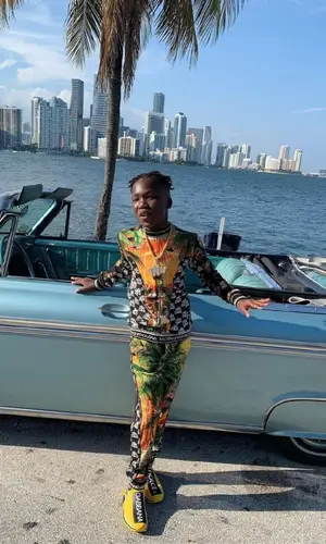 YNW BSlime wearing Dolce & Gabbana jacket