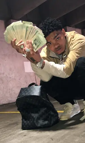No Cap wearing Rhude jacket