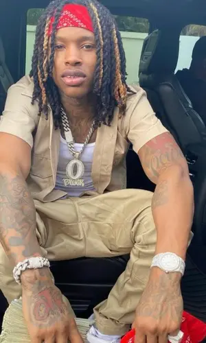 King Von wearing Nike sneakers