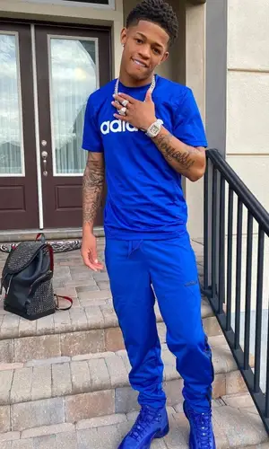 YK Osiris wearing Adidas t-shirt