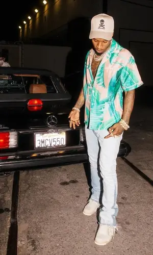 Tory Lanez wearing Dead Homies cap