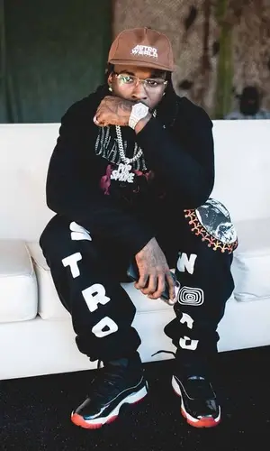 Pop Smoke wearing Travis Scott Merch pants