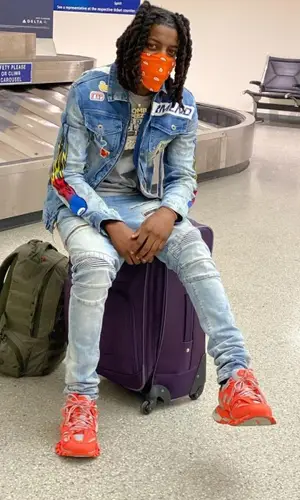 OMB Peezy wearing Dreamland jacket
