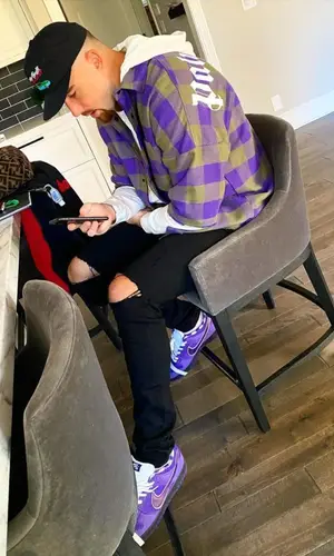 Travis Kelce wearing Amiri jeans