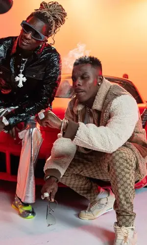 DaBaby wearing Gucci trousers