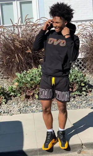 Mikey wearing Mixed Emotion shorts