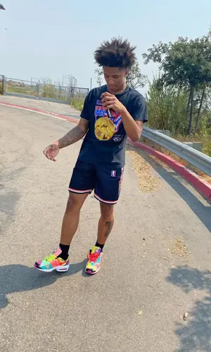 Mikey wearing Adidas sock