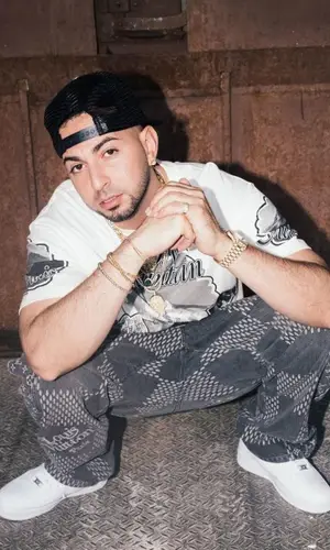 Justin Quiles wearing Louis Vuitton t-shirt